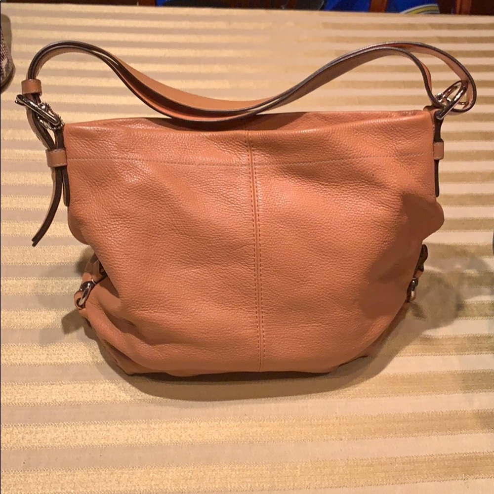 Authentic.Rust/orange color. All hardware in tact.